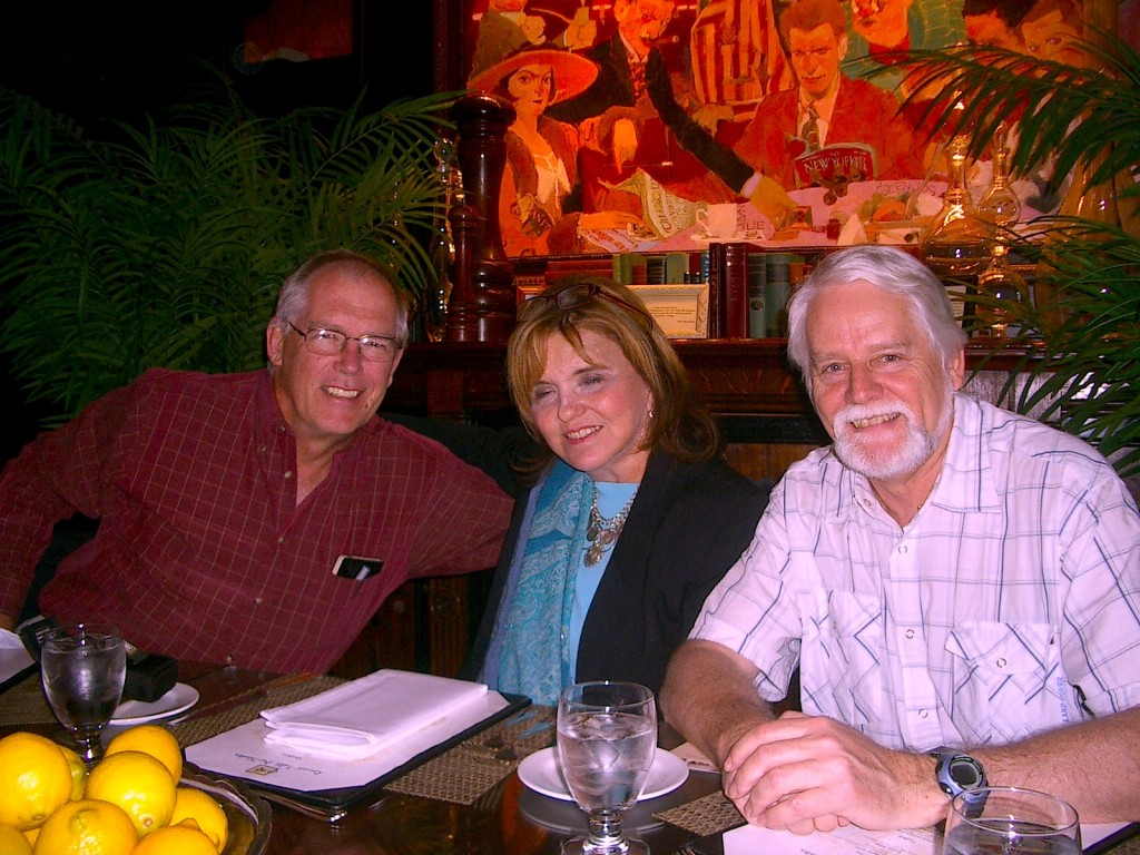 Seated at the round table are Stanley (left), Michael (right), with their agent, Marly Rusoff