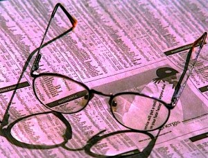 glasses on newspaper